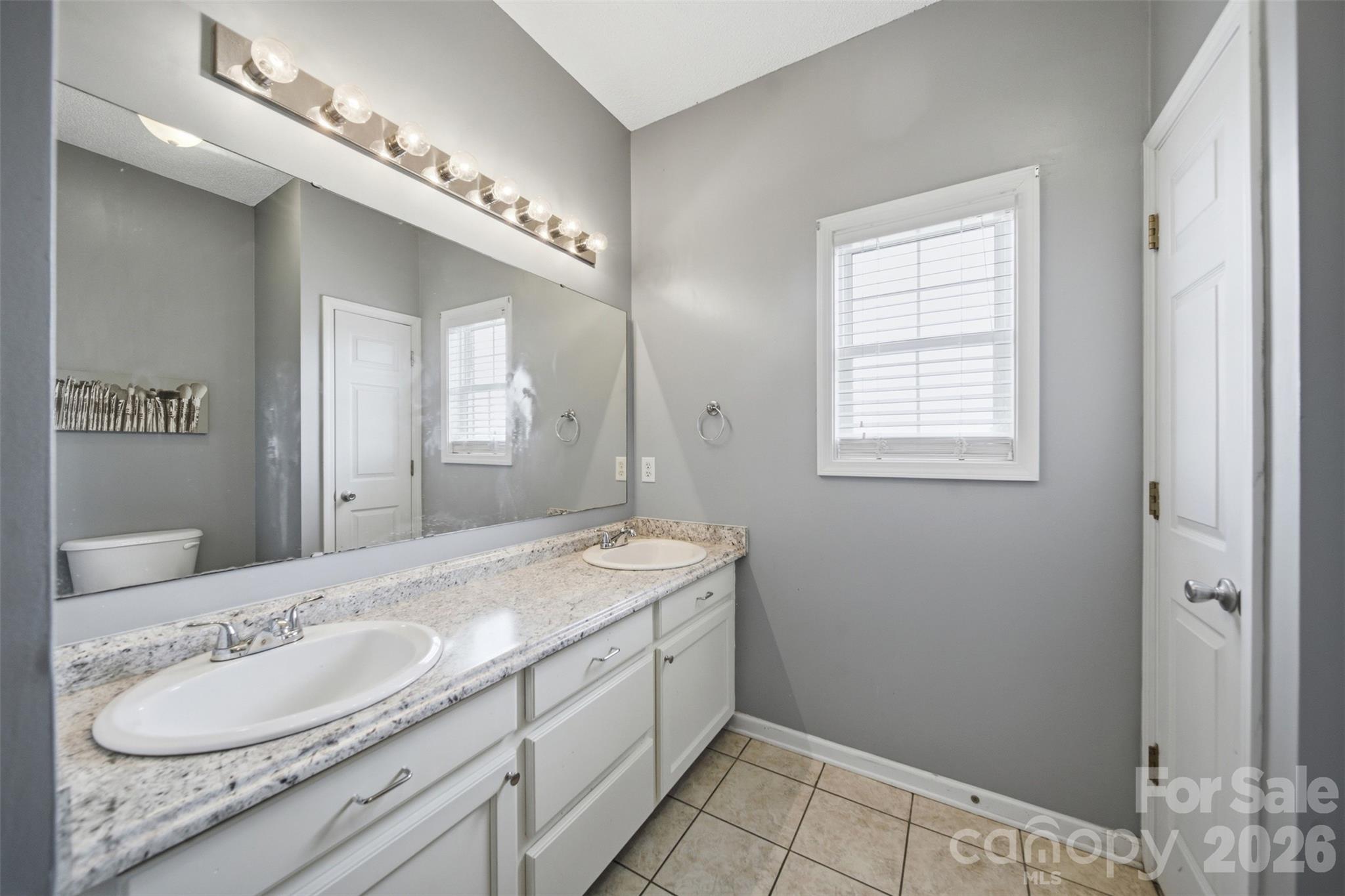 2535 Citrus Lane Sumter, SC 29153 - Photo 27 of 47 a bathroom with a granite countertop sink and a mirror