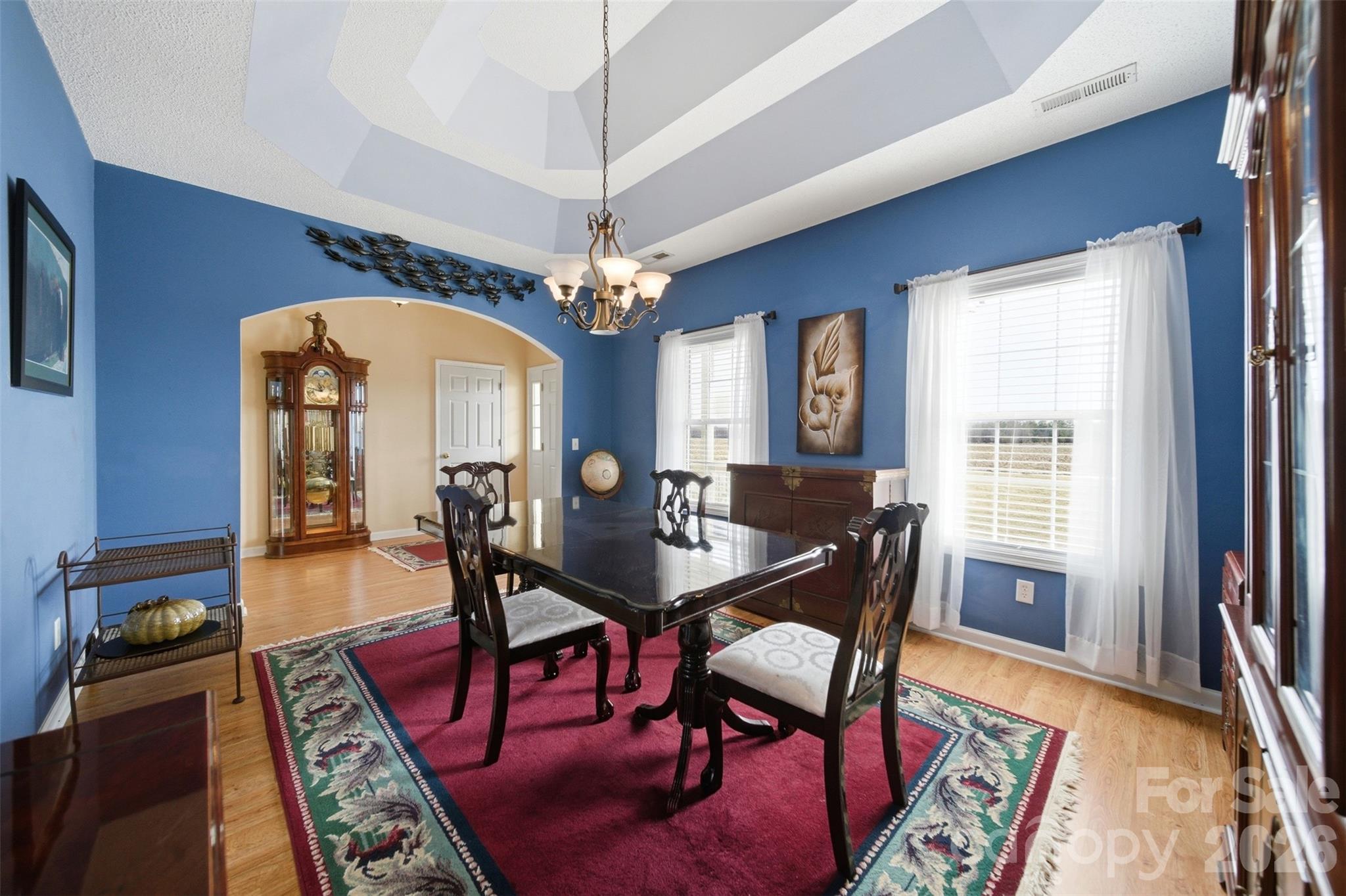 2535 Citrus Lane Sumter, SC 29153 - Photo 6 of 47 a dining room with furniture a rug a rug and a chandelier