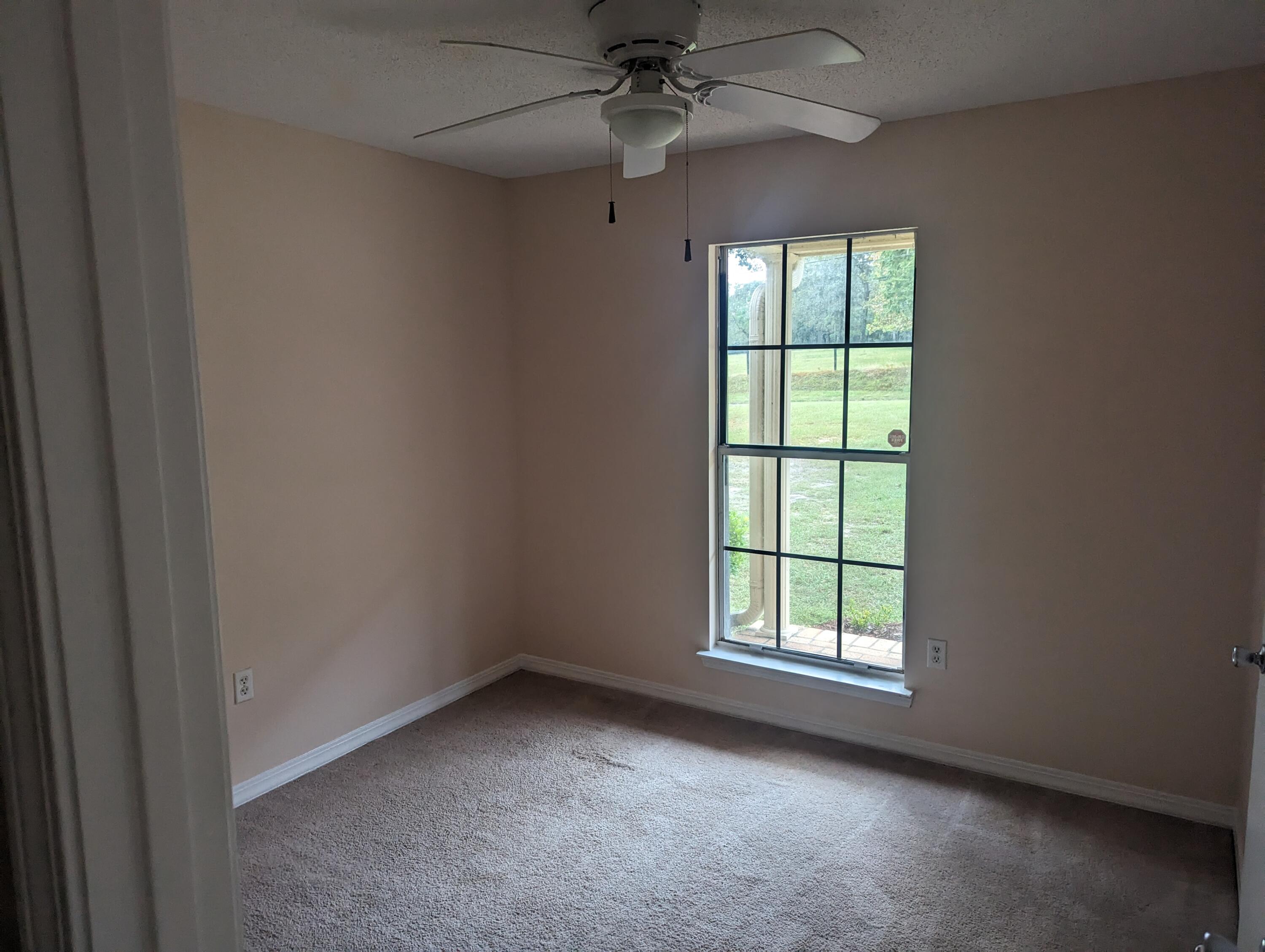 6008 Old Bethel Road Crestview, FL 32536 - Photo 15 of 36 an empty room with a window