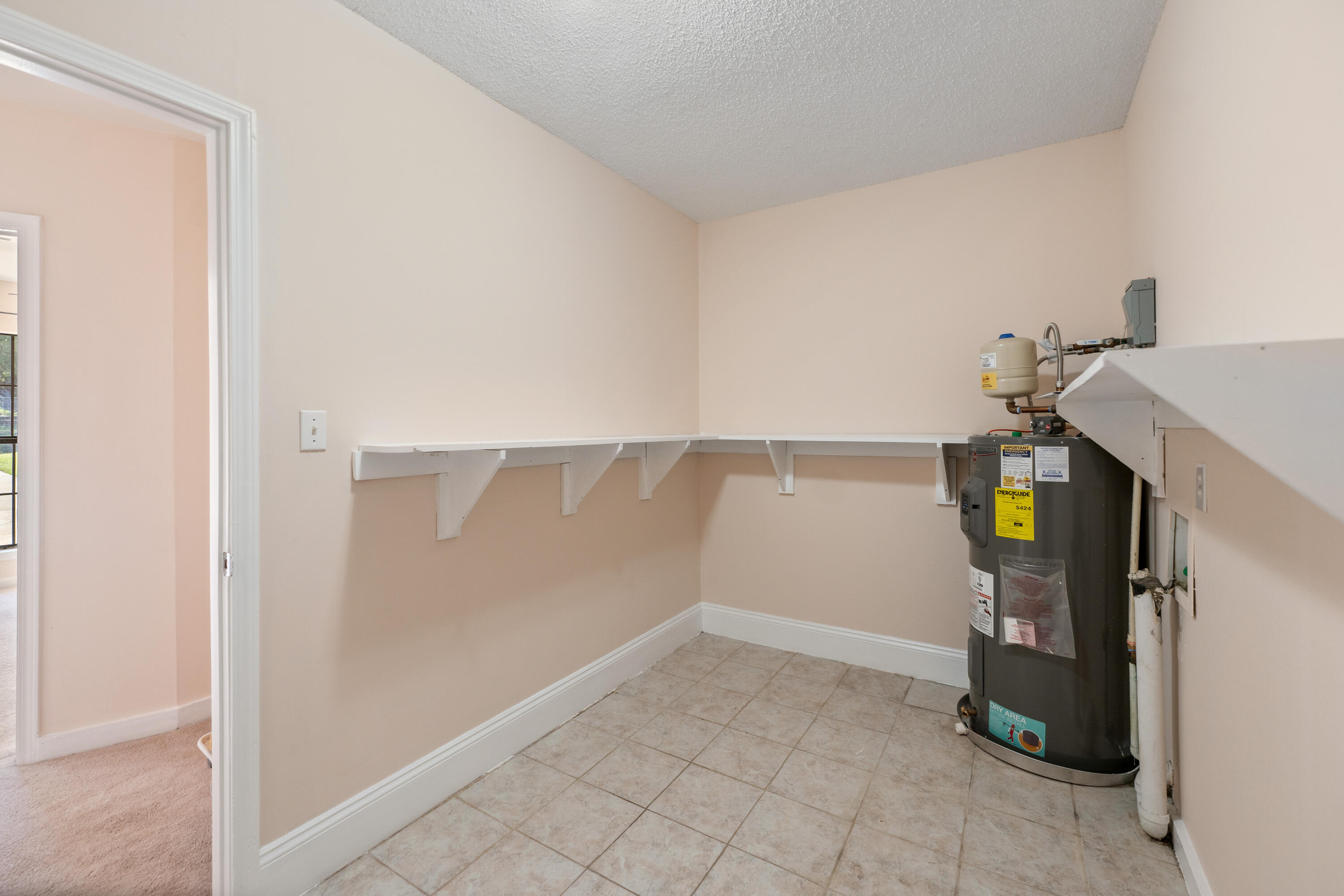 6008 Old Bethel Road Crestview, FL 32536 - Photo 20 of 36 a view of storage and utility room with washer and dryer