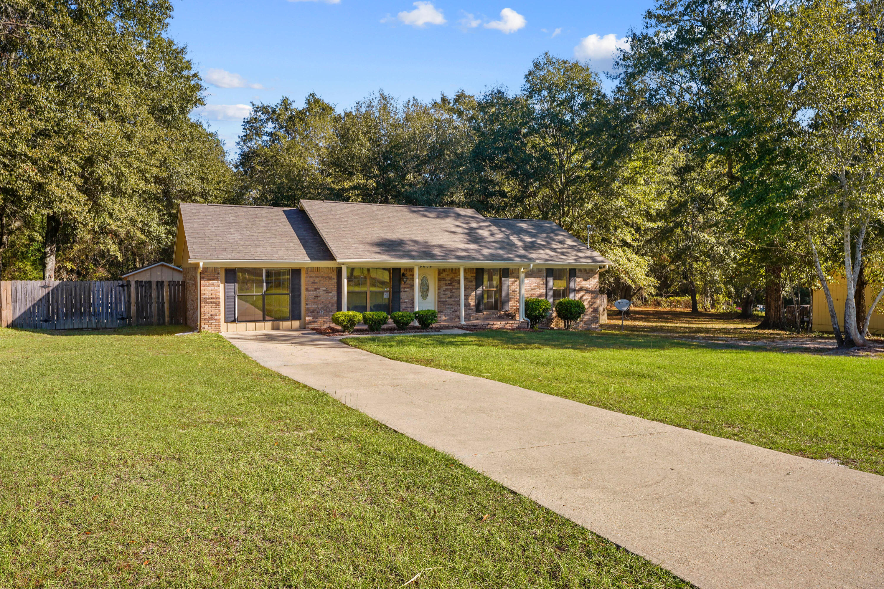 6008 Old Bethel Road Crestview, FL 32536 - Photo 2 of 36 a front view of a house with a yard