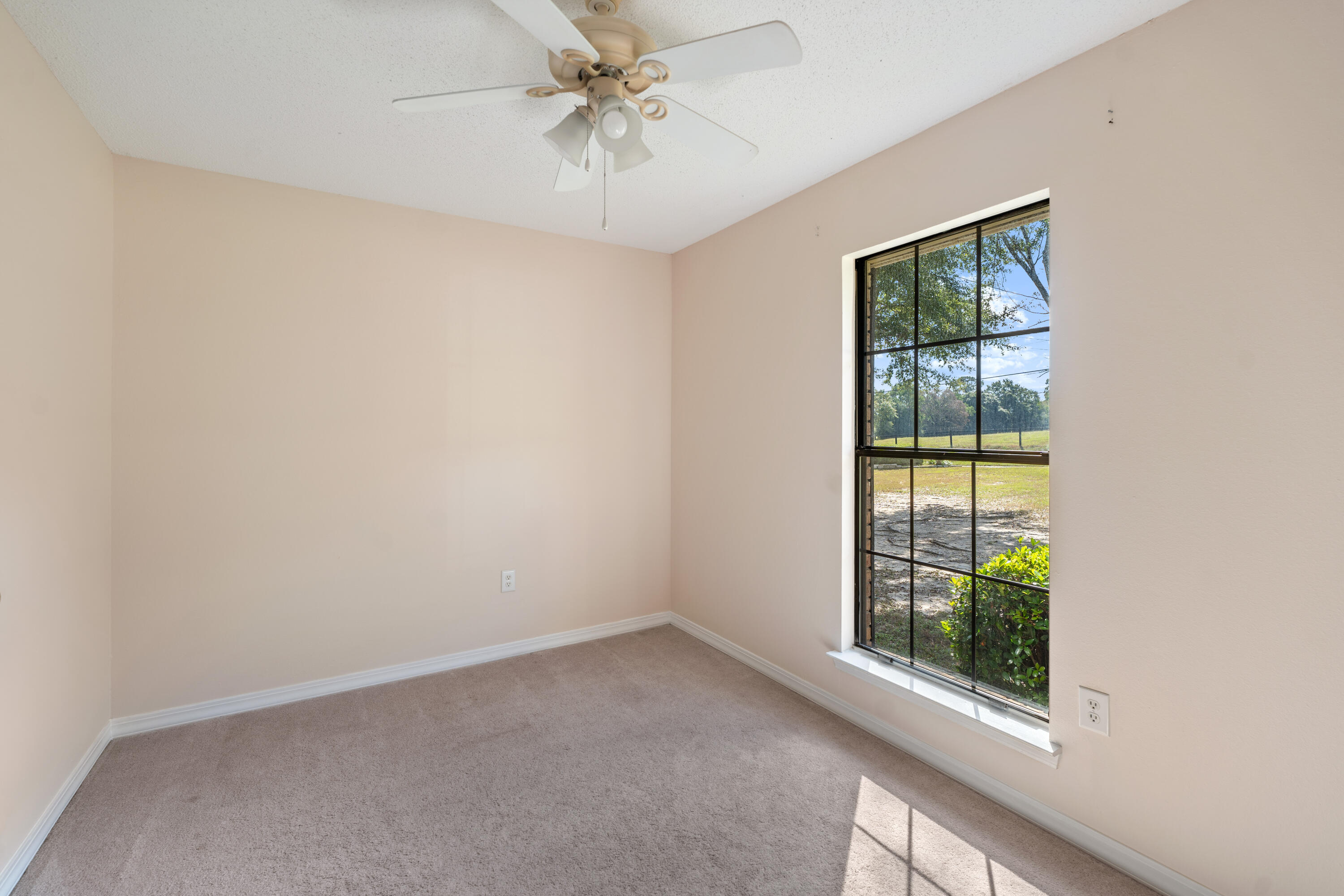 6008 Old Bethel Road Crestview, FL 32536 - Photo 26 of 36 an empty room with a window