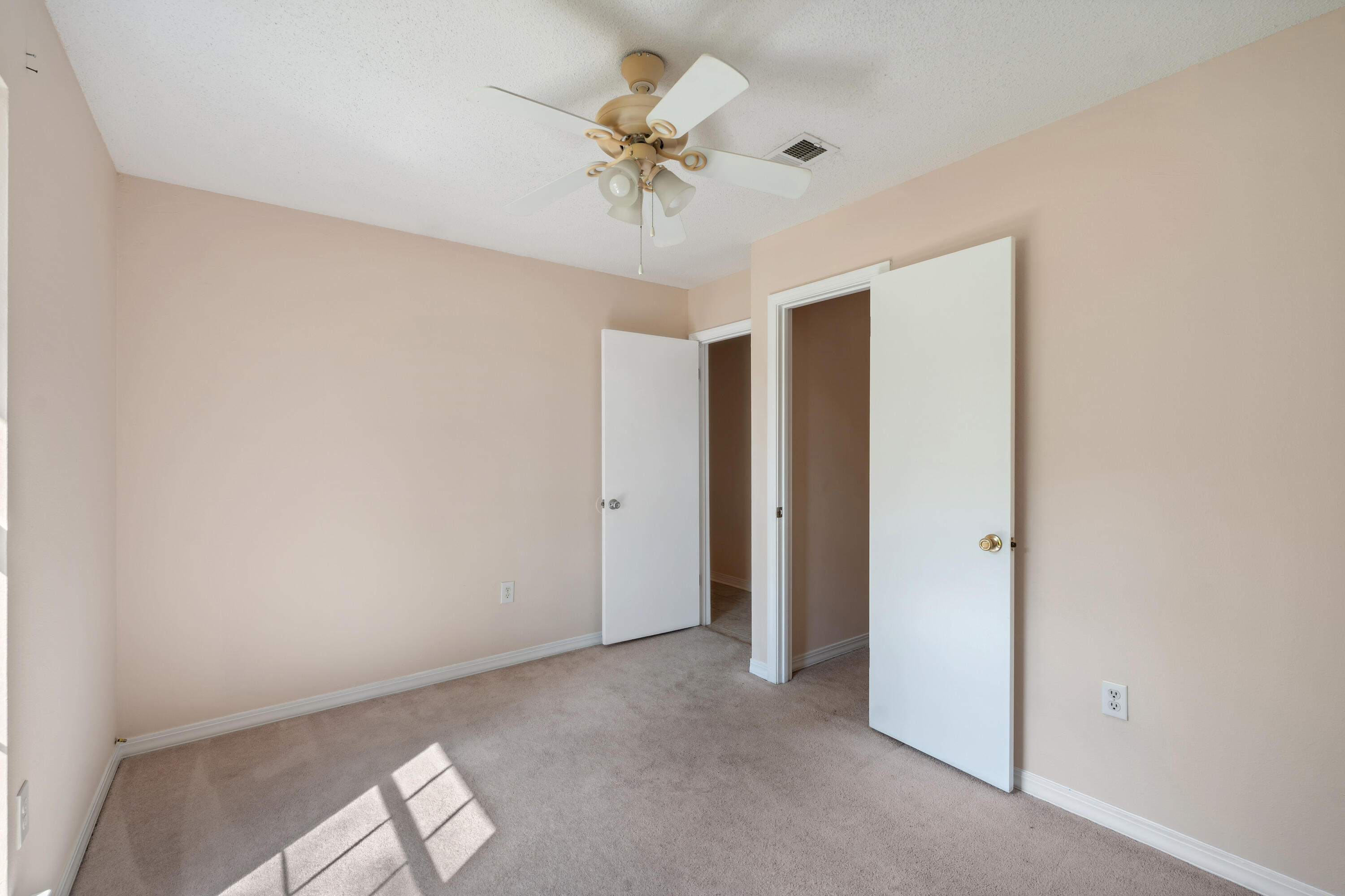 6008 Old Bethel Road Crestview, FL 32536 - Photo 27 of 36 a view of a room with a ceiling fan and a window