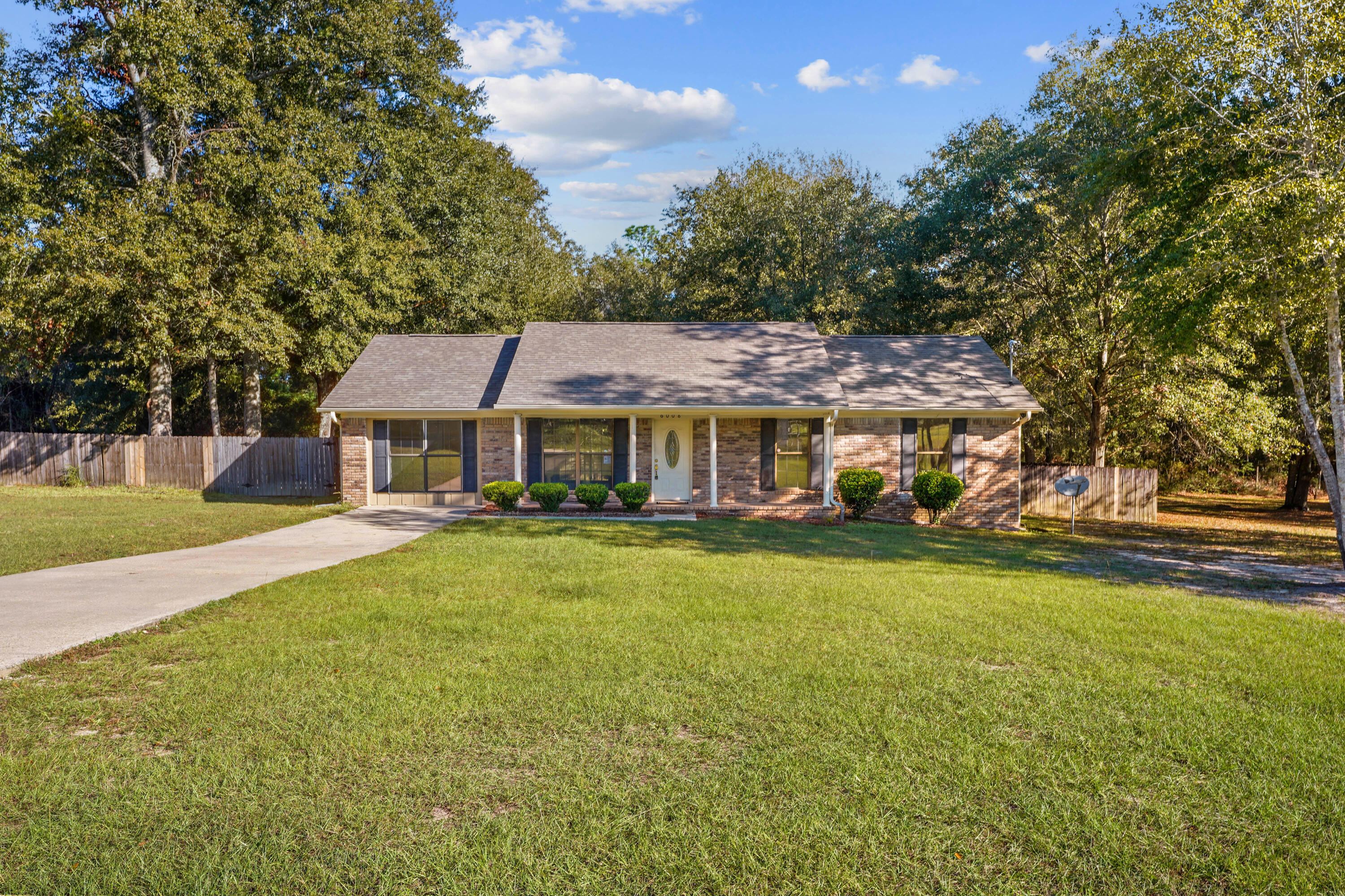 6008 Old Bethel Road Crestview, FL 32536 - Photo 35 of 36 a front view of a house with a garden