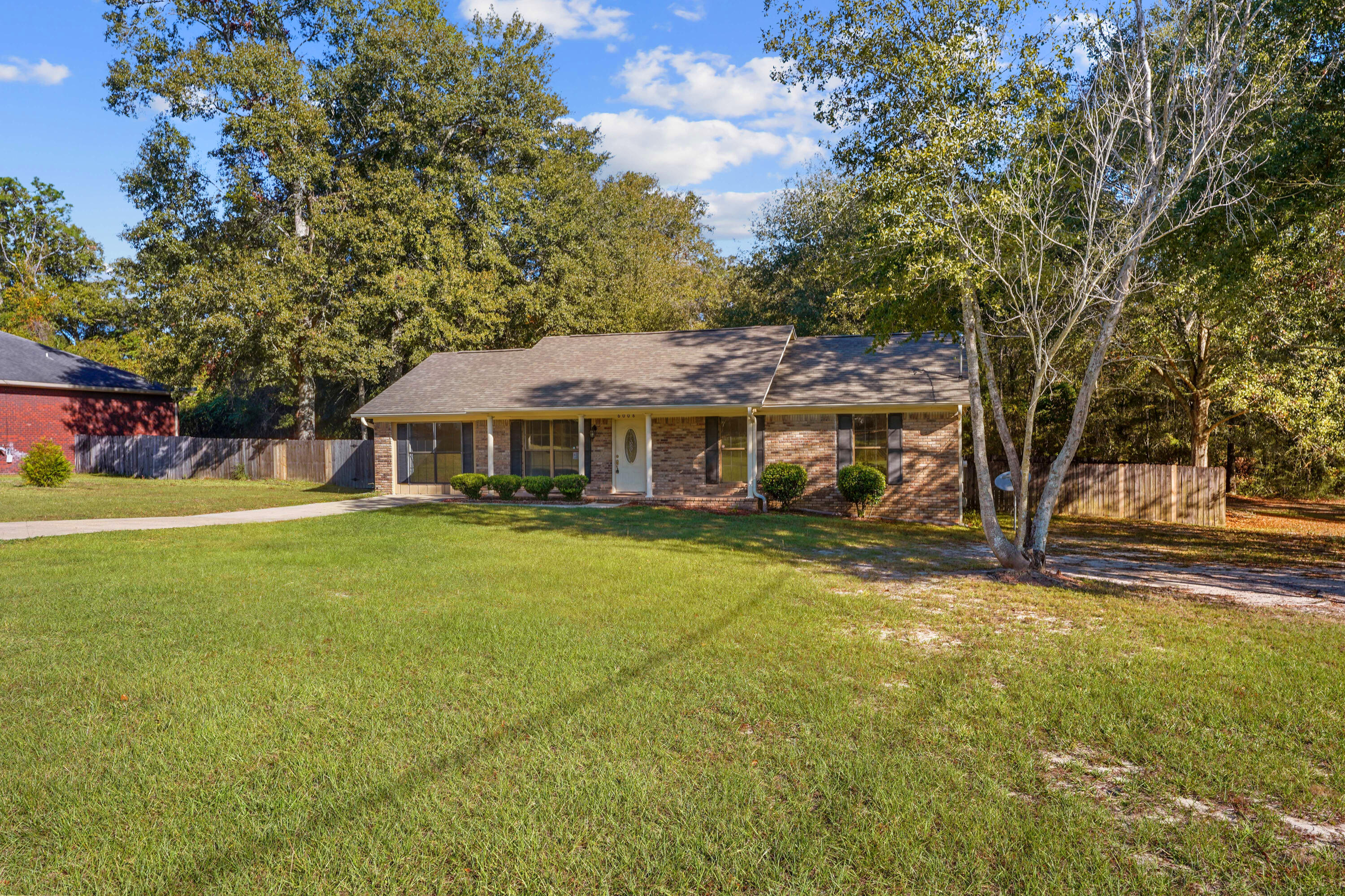 6008 Old Bethel Road Crestview, FL 32536 - Photo 36 of 36 a front view of a house with a garden