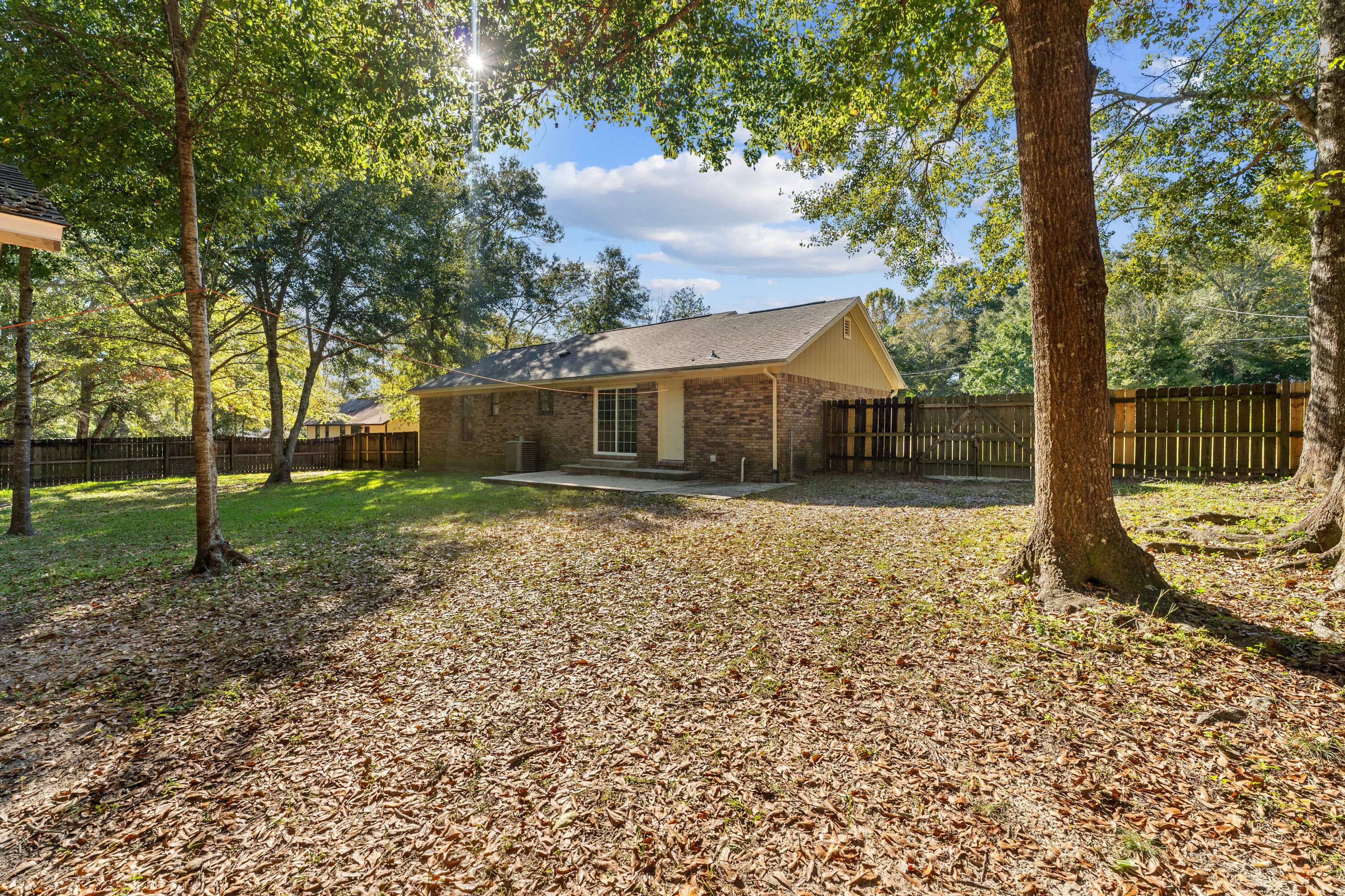6008 Old Bethel Road Crestview, FL 32536 - Photo 4 of 36 a front view of a house with a yard
