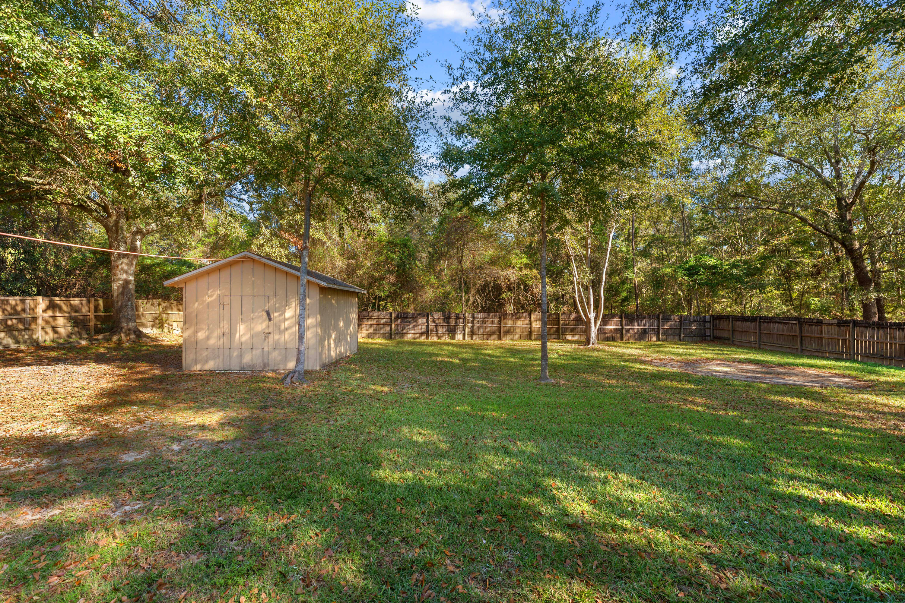 6008 Old Bethel Road Crestview, FL 32536 - Photo 6 of 36 a view of a trees in a yard