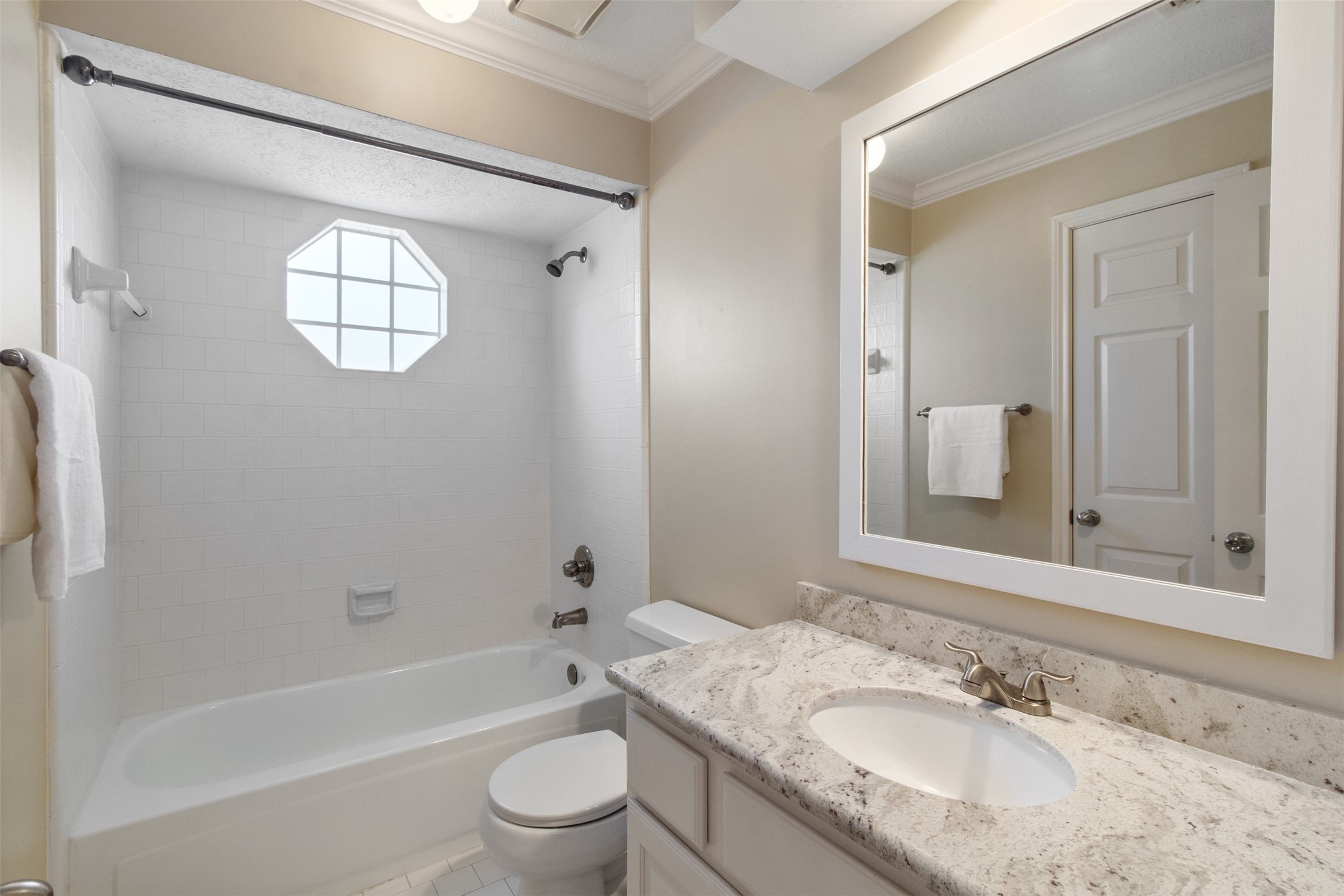 5127 Heathfield Court Houston, TX 77084 - Photo 21 of 37 Full updated bathroom is situated between the game room and second bedroom.