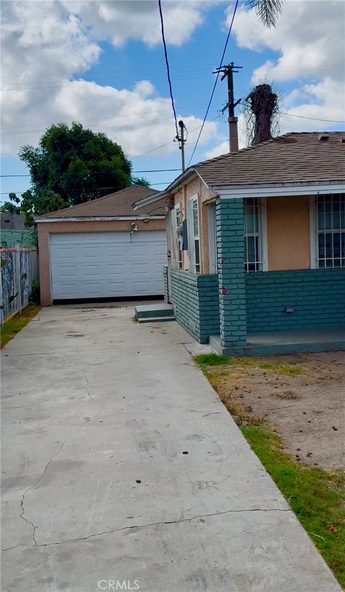2618 East 124th Street Compton, CA 90222 - Photo 3 of 16 a front view of a house with a yard