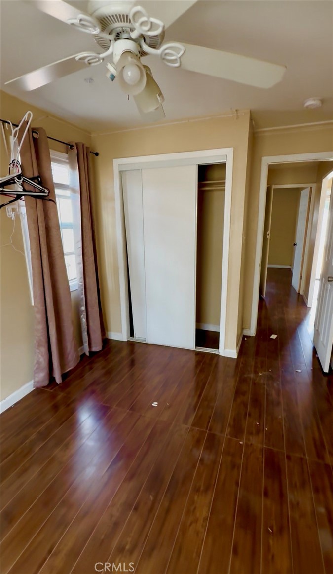2618 East 124th Street Compton, CA 90222 - Photo 8 of 16 wooden floor in an empty room with a fireplace