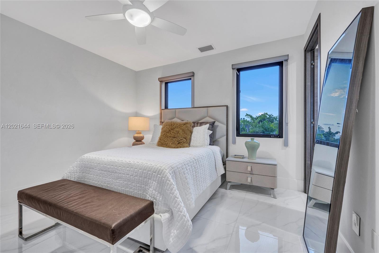 7800 Southwest 9th Terrace Miami, FL 33144 - Photo 52 of 64 a bedroom with a bed and a large window