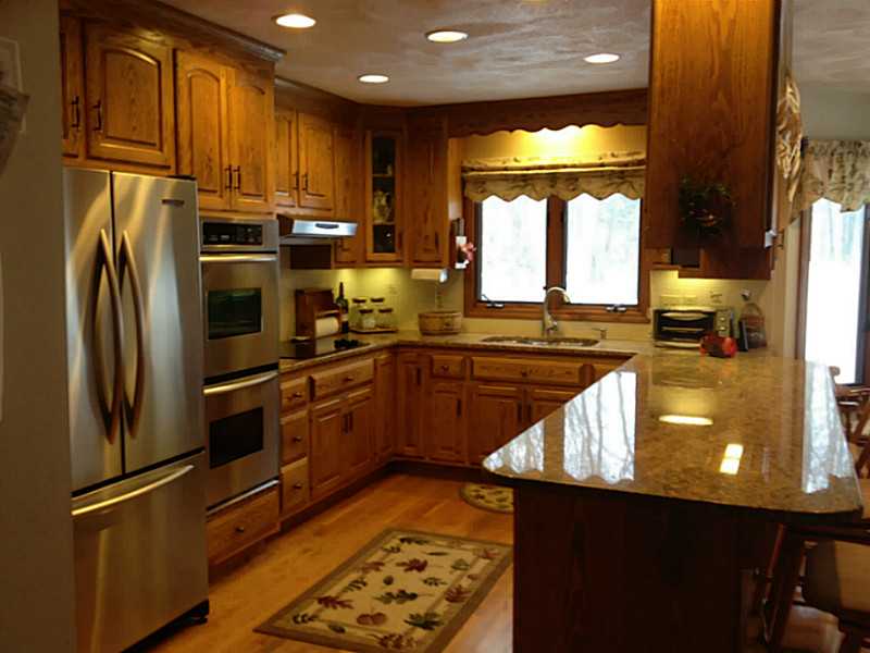 280 Tower Hill Road Cumberland, RI 02864 - Photo 2 of 21 Kitchen. Custom made oak cabinetry updated with SS, granite, recessed lighting, hard wood flooring!