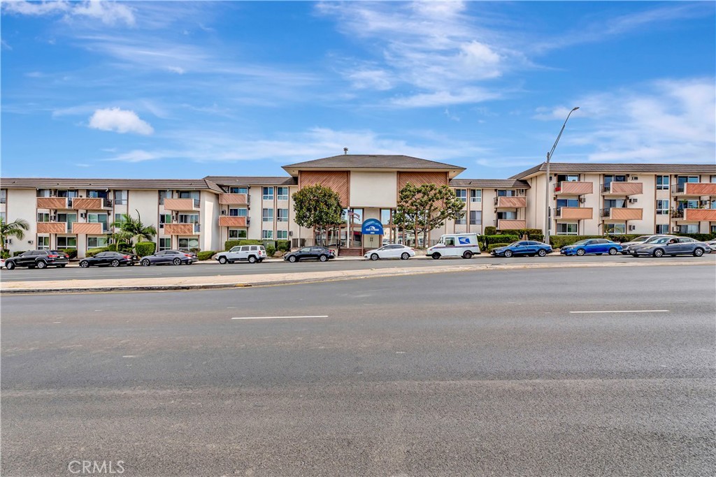 5585 Pacific Coast Highway, Unit 342 Long Beach, CA 90804 - Photo 1 of 32 a city street with a building and a street view