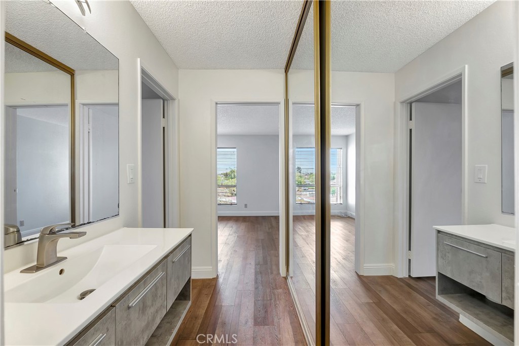 5585 Pacific Coast Highway, Unit 342 Long Beach, CA 90804 - Photo 13 of 32 a bathroom with a sink and a mirror