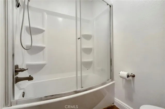 a bathroom with a bath tub and a shower