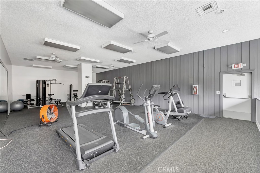 5585 Pacific Coast Highway, Unit 342 Long Beach, CA 90804 - Photo 21 of 32 a view of a room with gym equipment
