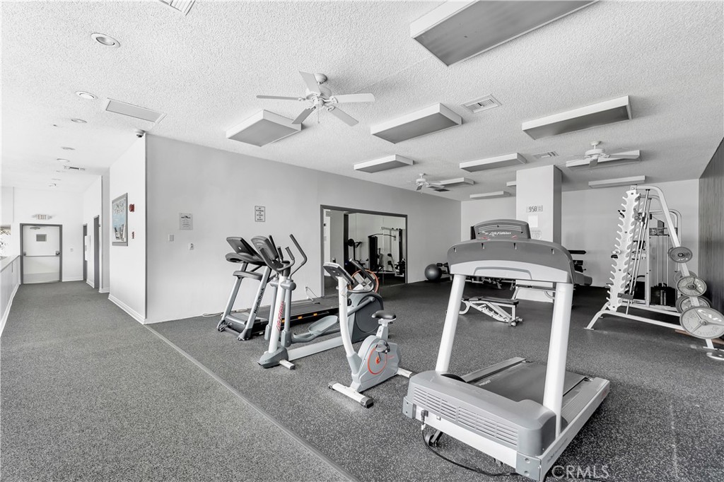 5585 Pacific Coast Highway, Unit 342 Long Beach, CA 90804 - Photo 22 of 32 a view of a room with gym equipment