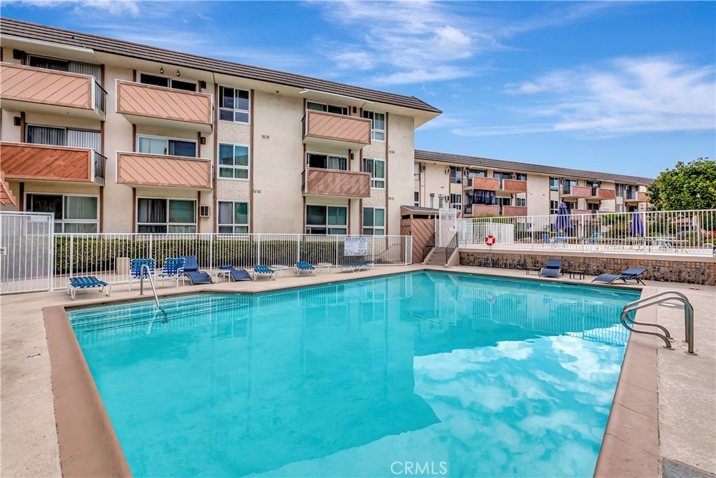 5585 Pacific Coast Highway, Unit 342 Long Beach, CA 90804 - Photo 27 of 32 a swimming pool view with a outdoor seating space