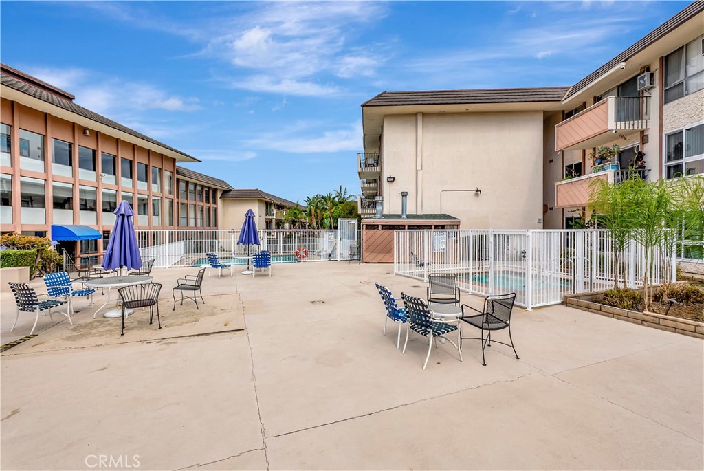 5585 Pacific Coast Highway, Unit 342 Long Beach, CA 90804 - Photo 28 of 32 a view of a patio with couches table and chairs and potted plants