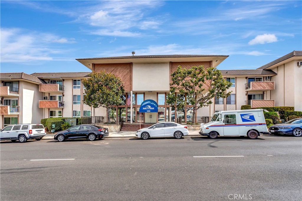 5585 Pacific Coast Highway, Unit 342 Long Beach, CA 90804 - Photo 31 of 32 a cars parked in front of a building