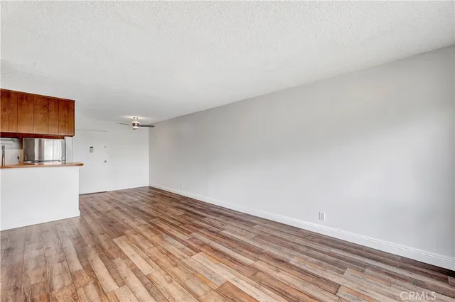 a view of wooden floor and cabinet in a room