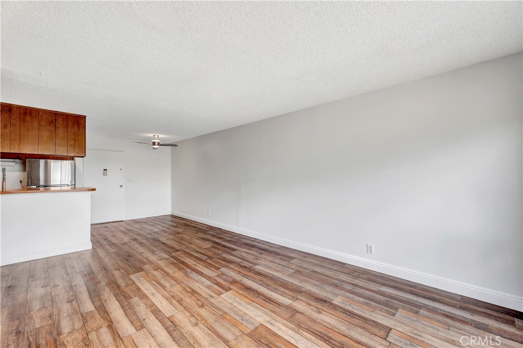 5585 Pacific Coast Highway, Unit 342 Long Beach, CA 90804 - Photo 9 of 32 a view of wooden floor and cabinet in a room