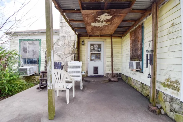 a view of a porch with furniture