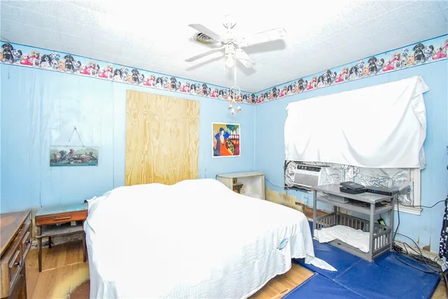 a bedroom with a bed and a table