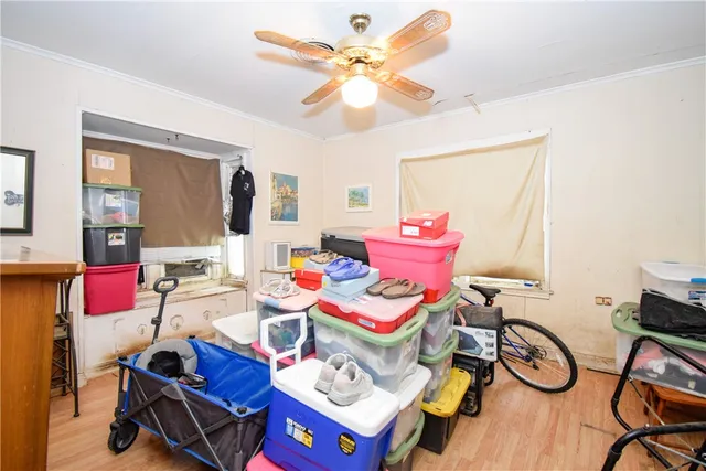 a living room with furniture a chandelier and a flat screen tv