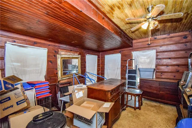 a living room with furniture a rug and a table