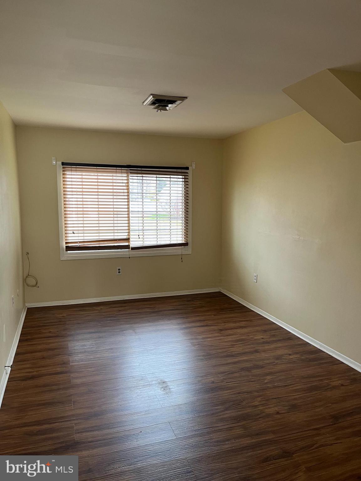 42 Genesee Lane Willingboro, NJ 08046 - Photo 12 of 29 an empty room with wooden floor and windows