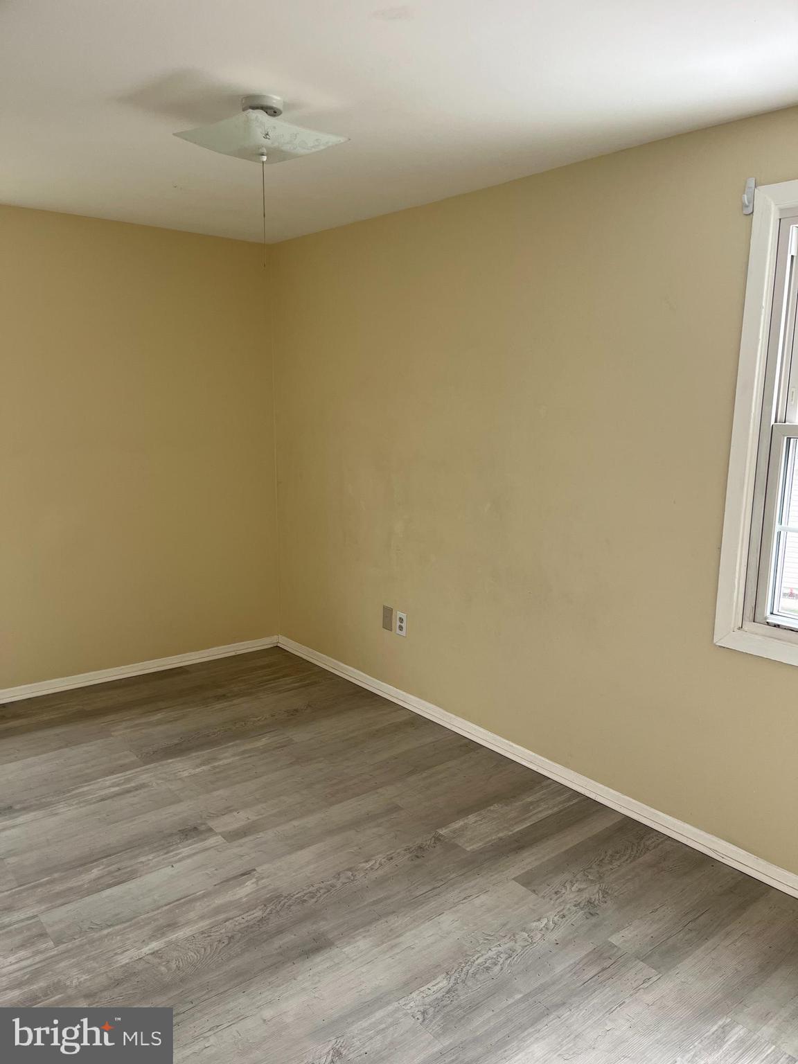 42 Genesee Lane Willingboro, NJ 08046 - Photo 16 of 29 an empty room with wooden floor and windows