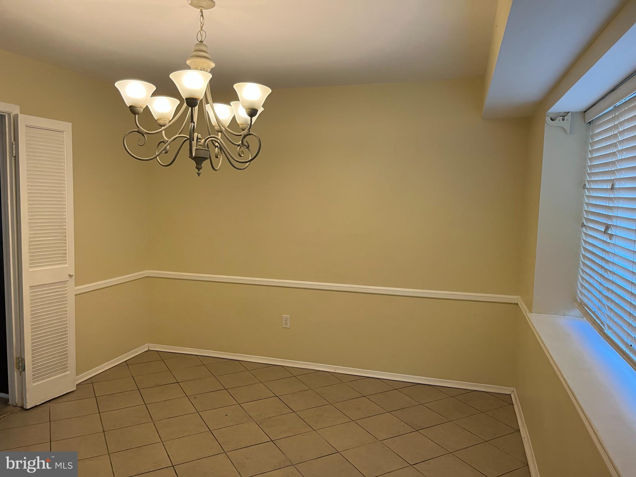 42 Genesee Lane Willingboro, NJ 08046 - Photo 4 of 29 a view of a chandelier in big room with a chandelier fan