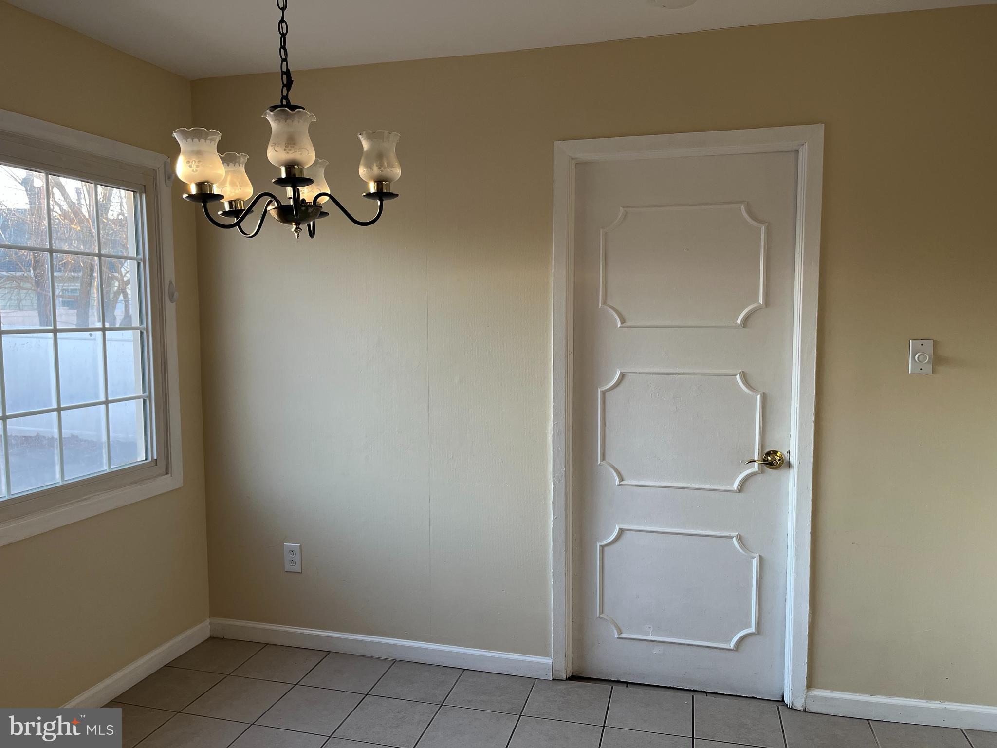 42 Genesee Lane Willingboro, NJ 08046 - Photo 5 of 29 a view of a bathroom with a hanging light fixture and a glass door