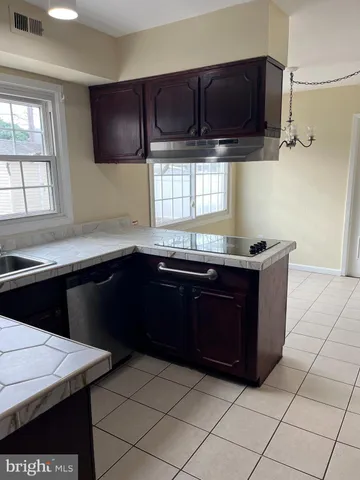 a kitchen with a sink and a stove