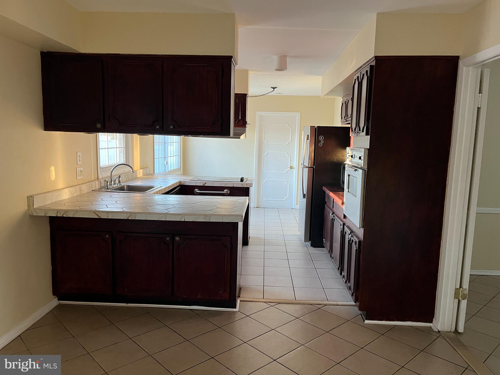 42 Genesee Lane Willingboro, NJ 08046 - Photo 8 of 29 a kitchen with a sink and a refrigerator