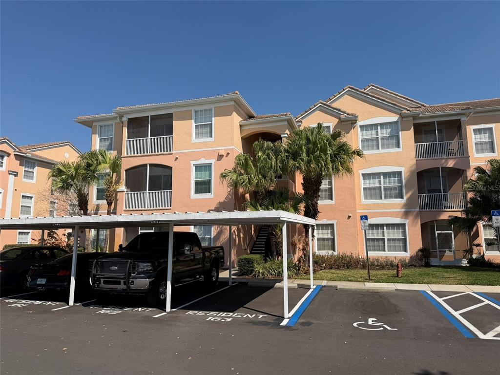 13560 Turtle Marsh Loop, Unit 332 Orlando, FL 32837 - Photo 1 of 16 a view of a building with a street