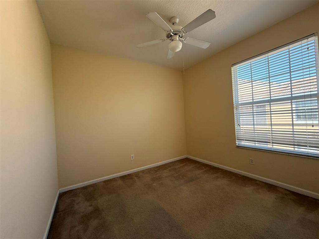 13560 Turtle Marsh Loop, Unit 332 Orlando, FL 32837 - Photo 14 of 16 an empty room with a window