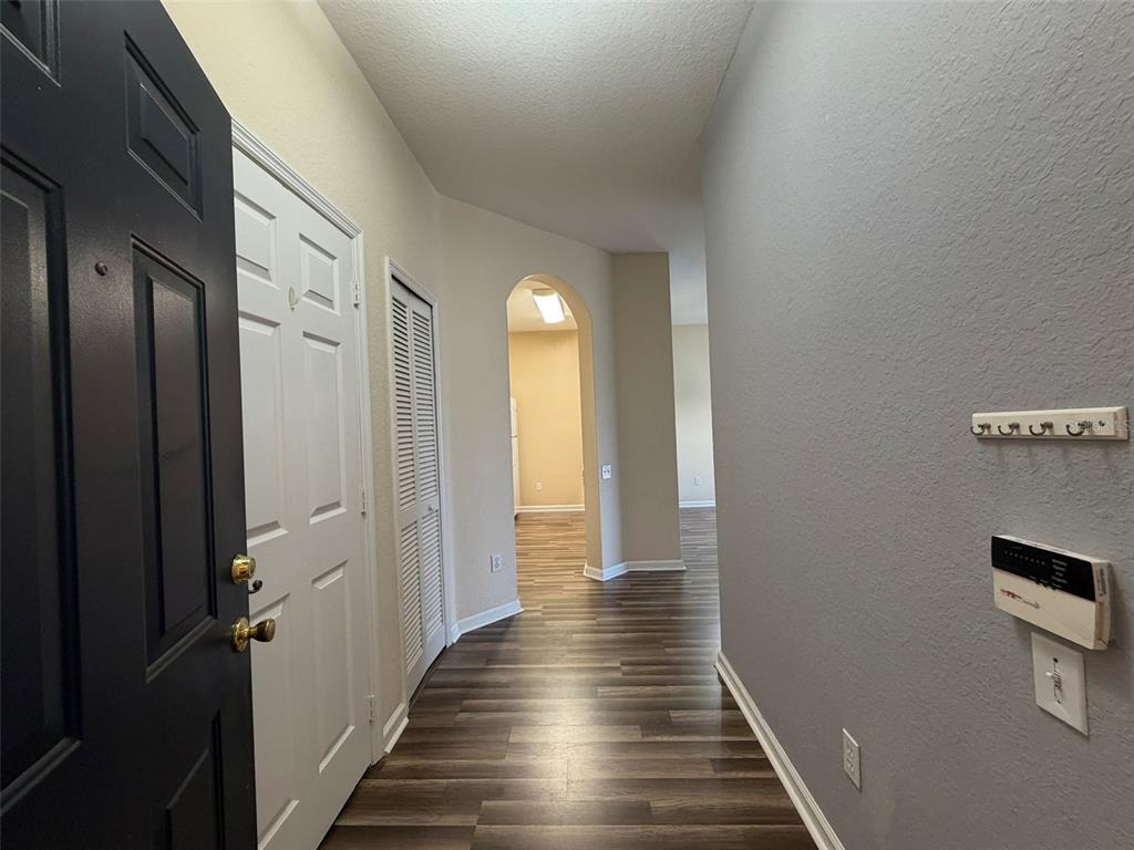 13560 Turtle Marsh Loop, Unit 332 Orlando, FL 32837 - Photo 3 of 16 a view of a hallway with wooden floor