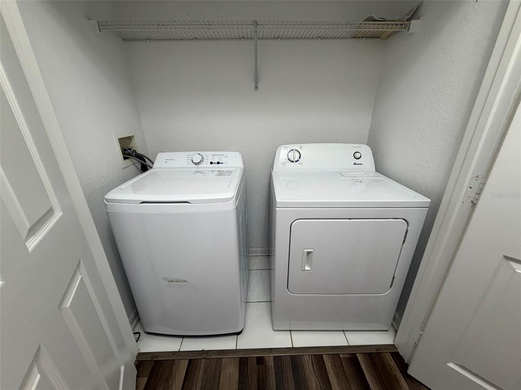 13560 Turtle Marsh Loop, Unit 332 Orlando, FL 32837 - Photo 8 of 16 a utility room with dryer and washer