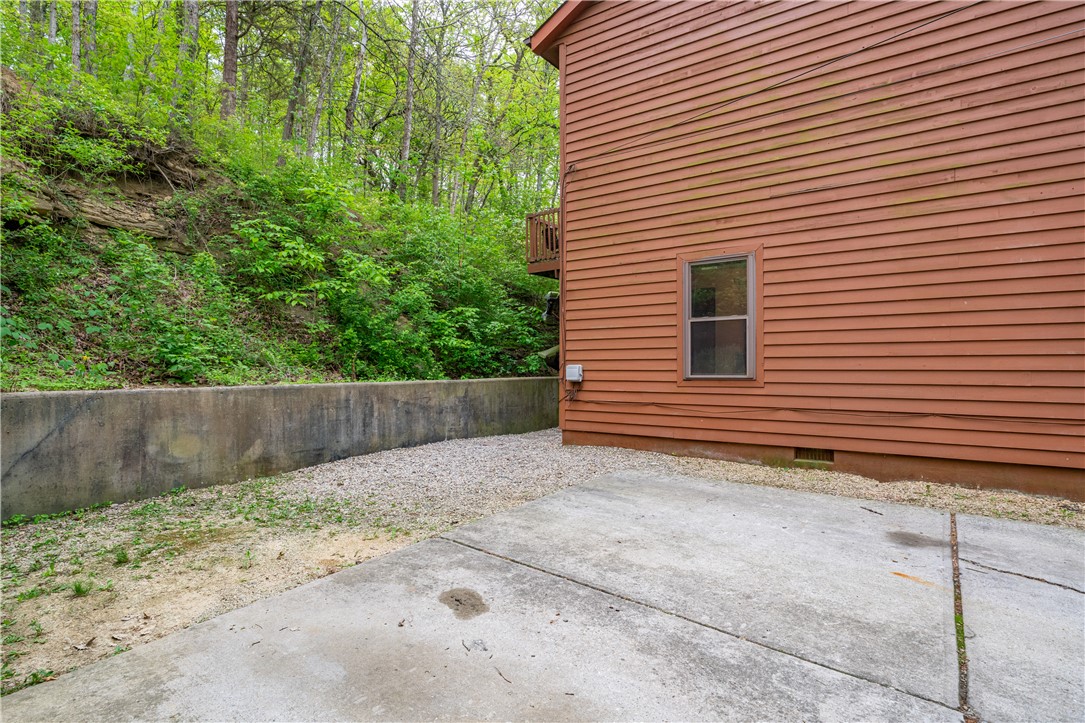 10584 New Biddinger Road Harrison, OH 45030 - Photo 40 of 61 This property features durable wood siding set against a lush, natural backdrop.