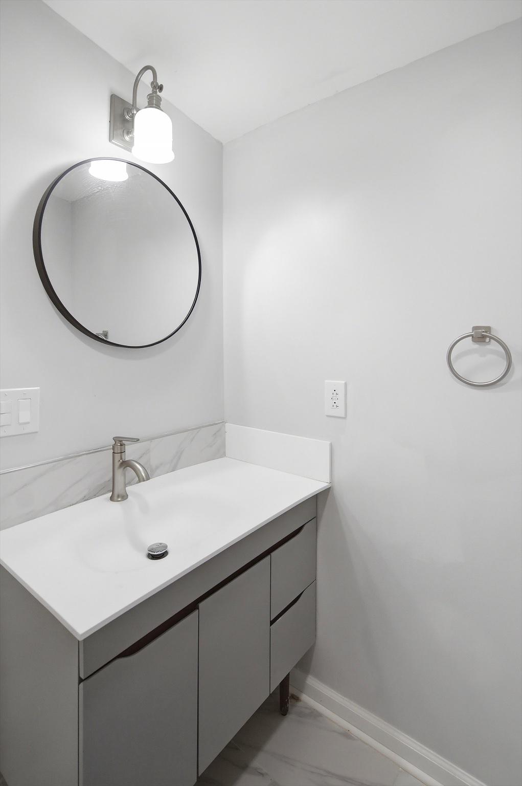 2589 Yardville Hamilton Square Road Hamilton, NJ 08690 - Photo 19 of 24 Sleek modern half bathroom with elegant fixtures.