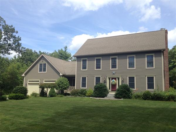 222 Charnock Hill Road Rutland, MA 01543 - Photo 1 of 24 a front view of a house with a garden