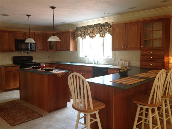 222 Charnock Hill Road Rutland, MA 01543 - Photo 2 of 24 a kitchen with stainless steel appliances granite countertop a sink a stove and a wooden floors