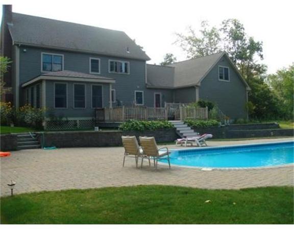 222 Charnock Hill Road Rutland, MA 01543 - Photo 23 of 24 a front view of house with yard and outdoor seating