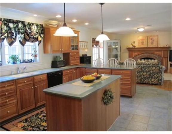 222 Charnock Hill Road Rutland, MA 01543 - Photo 4 of 24 a kitchen with a sink a stove and chairs