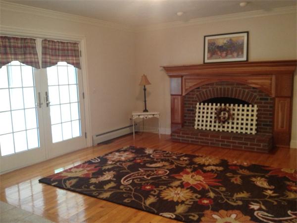222 Charnock Hill Road Rutland, MA 01543 - Photo 7 of 24 a living room with a fireplace