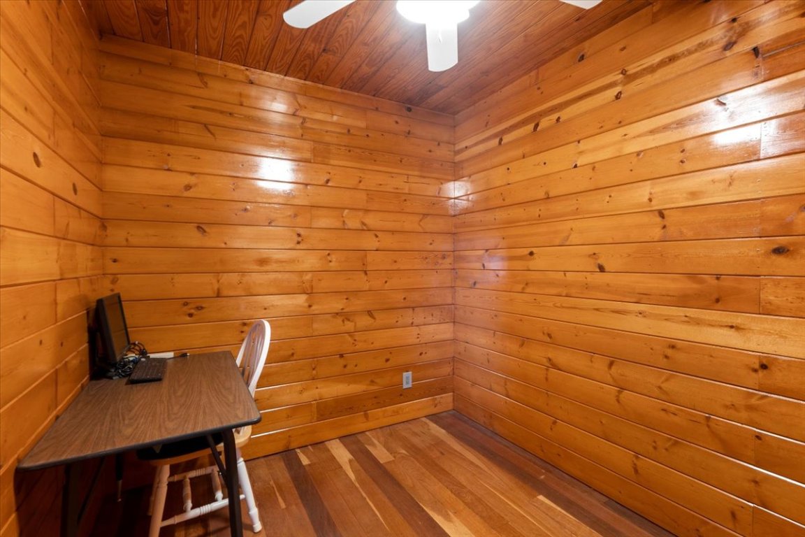 4339 Pettytown Road Dale, TX 78616 - Photo 11 of 33 Unfurnished office with a relaxing sauna, wood-type flooring, wooden ceiling, and a ceiling fan