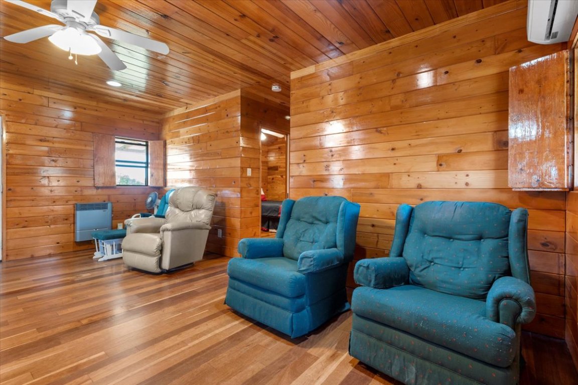 4339 Pettytown Road Dale, TX 78616 - Photo 13 of 33 Sitting room with wood finished floors, a ceiling fan, and wood ceiling