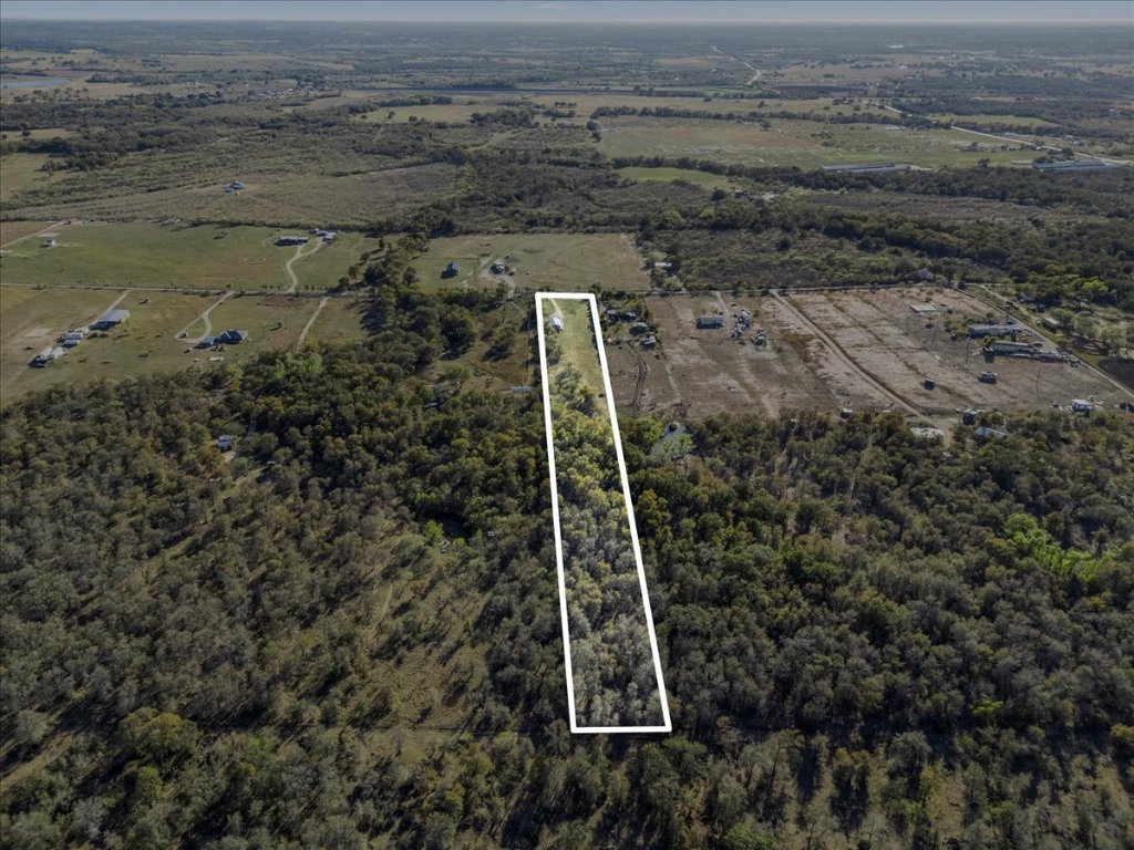 4339 Pettytown Road Dale, TX 78616 - Photo 32 of 33 Aerial overview of property's location featuring property parcel outlined and a heavily wooded area